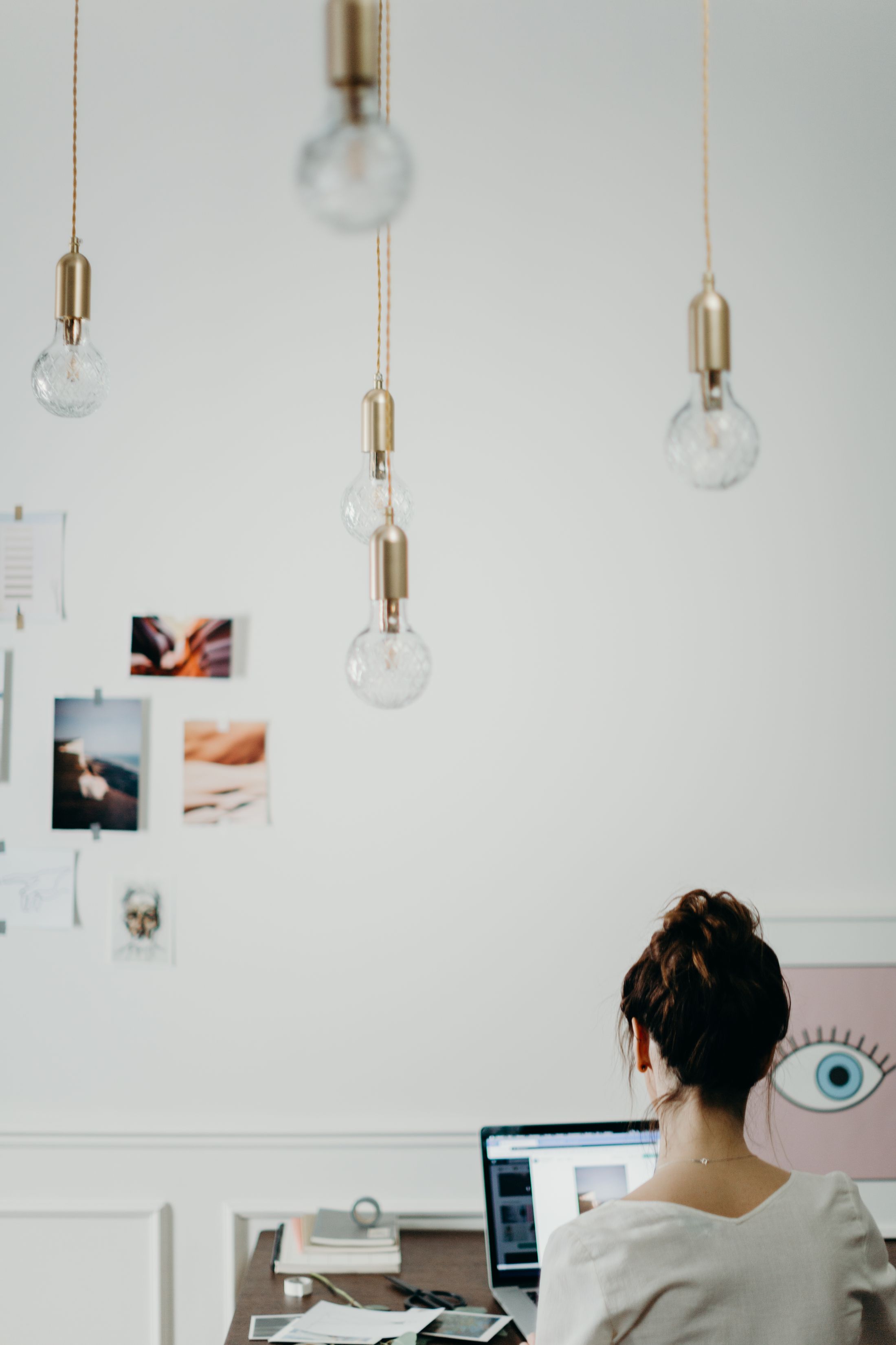 A creator filming a new story in her workspace